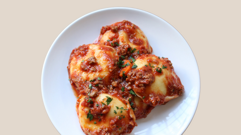 Cheese Ravioli with Bolognese and Parmigiano